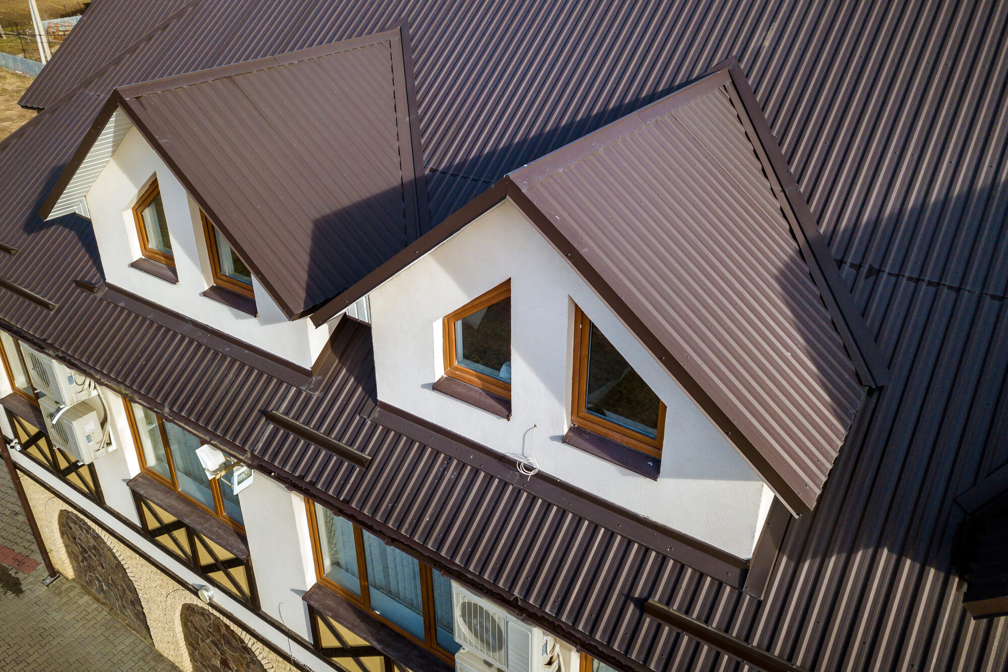 Aerial view of a commercial building with a durable metal roof
